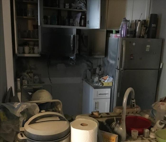 Kitchen with ruined contents from water damage. 