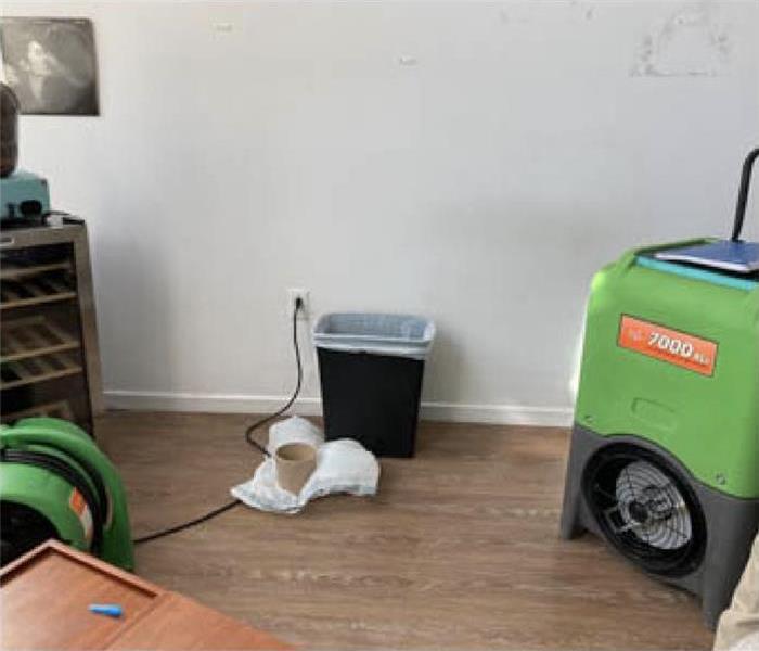 Drying equipment, trash can, clean floor after suffering from water damage